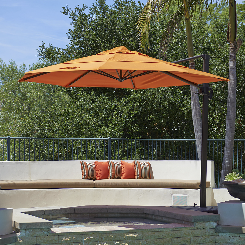 Image of the Cali Series Patio Umbrella by California Umbrella, exemplifying the innovative and versatile spirit of California. This cantilevered umbrella features a framework that eliminates the need for a center mast, offering a flexible, open space that adapts seamlessly to various outdoor settings. With its 360-degree rotation and dynamic side tilt, the Cali Series provides comprehensive control over shading, perfect for poolside lounging or garden gatherings. The modern design merges style with functionality, capturing the essence of California’s diverse lifestyle and landscape inspirations.