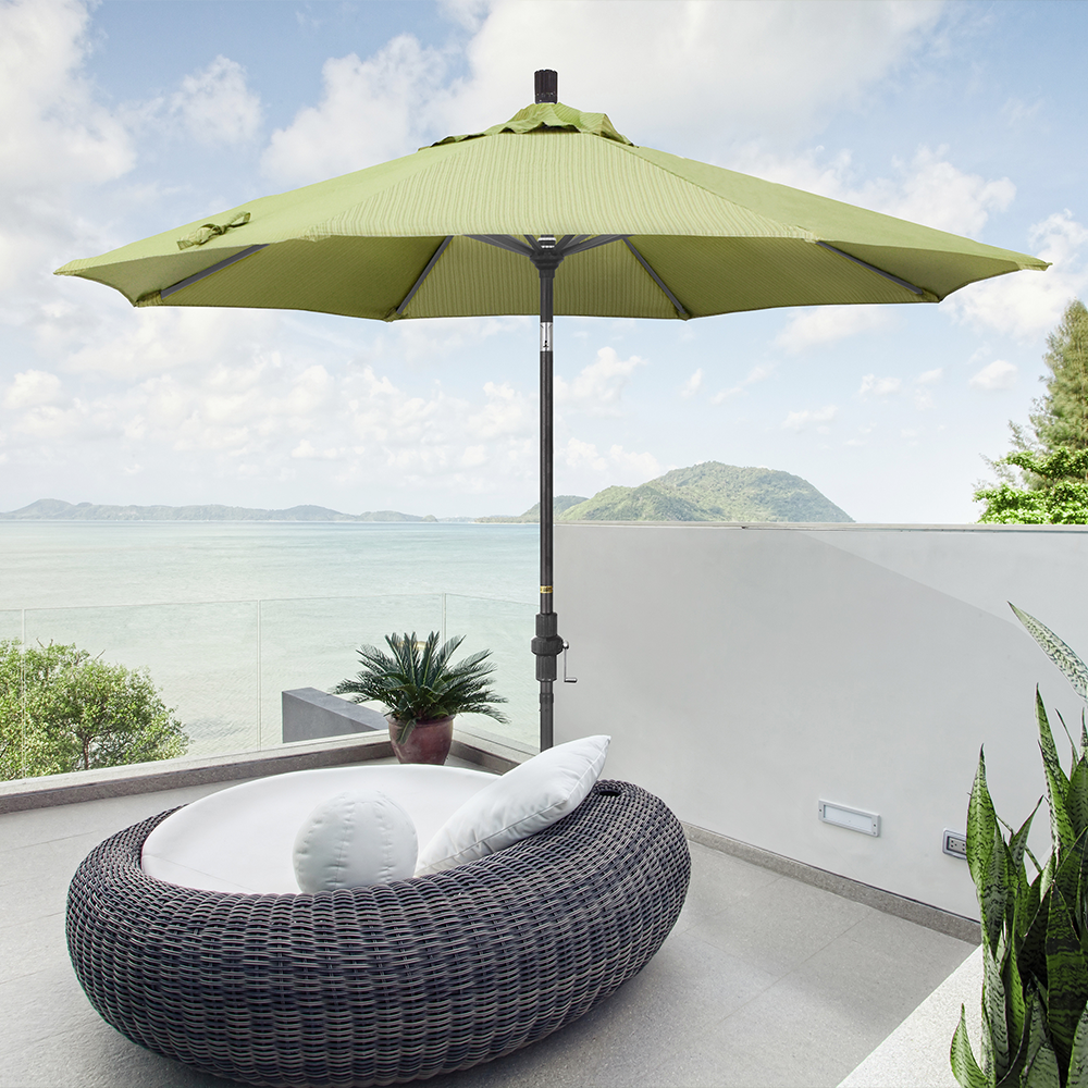 Image of the Golden State Series Patio Umbrella by California Umbrella, set against a backdrop reminiscent of California's golden sunsets. This umbrella captures the essence of the Golden State with its soft, warm hues and elegant design, ideal for enhancing outdoor relaxation. Equipped with a revolutionary collar tilt and easy crank lift, the Golden State Series offers smooth shade adjustments, allowing for uninterrupted enjoyment of the day's last rays. Crafted with durable aluminum construction and reliable aluminum ribs, it combines functionality with a contemporary classic style that embodies the tranquil charm of California's iconic sunsets.