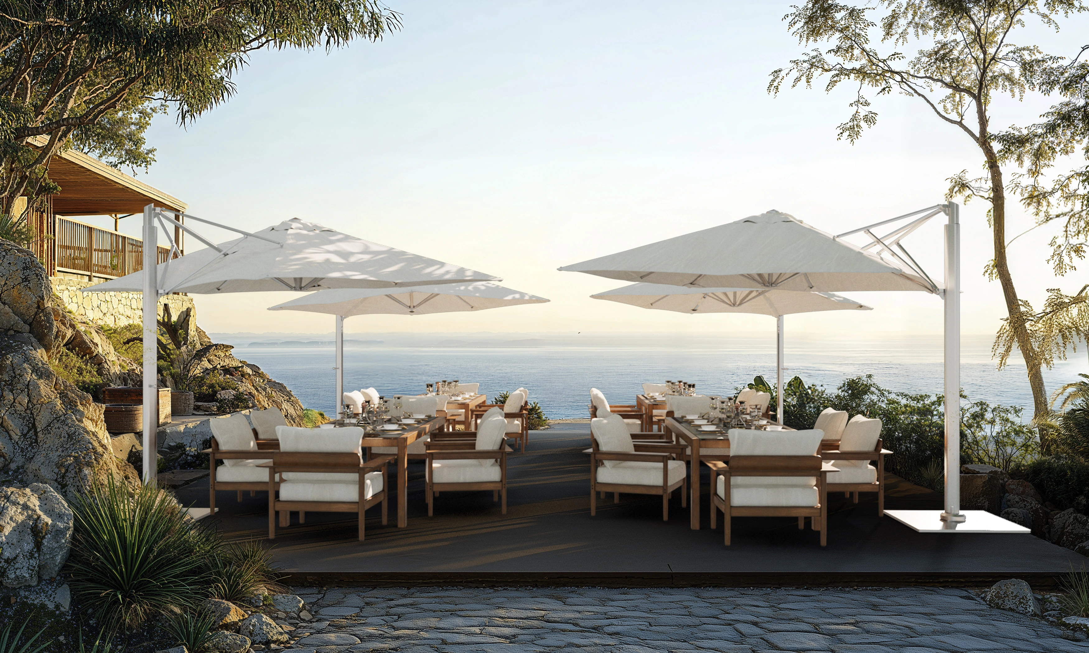 Solana Series commercial patio umbrella with an aluminum center mast, crank lift, 360° rotation, and aluminum ribs with wind stabilizers, providing elegant shade over a luxurious poolside lounge at an upscale resort. This California umbrella enhances the setting with plush waterproof loungers and a stylish wooden side table with a refreshing drink, creating the perfect relaxation spot.